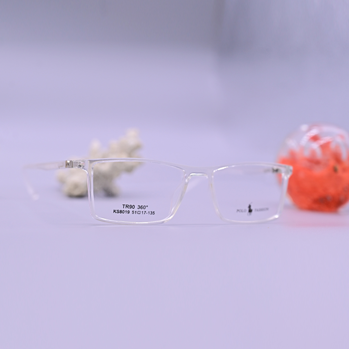 نظارة طبية ماركة بولو فاشن موديل 8019، إطار كامل من الأسيتات الشفاف (Crystal Clear) مع أذرع معدنية أنيقة باللون الفضي، متوفرة لدى متجر عين العون.