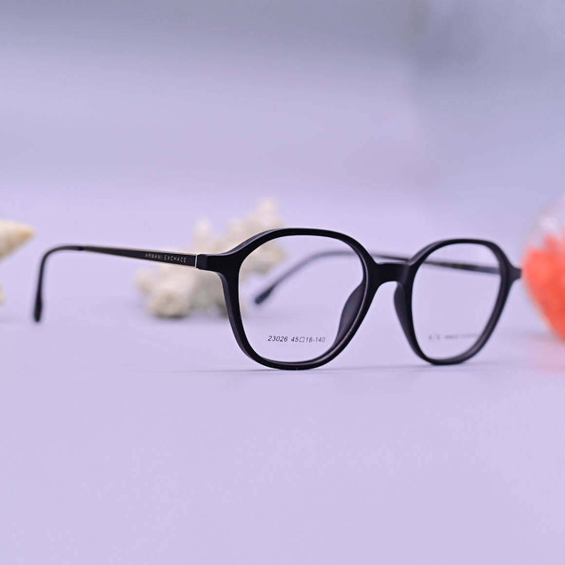 نظارة ارماني اكس تشانج طبية موديل 23026 بإطار كامل دائري بلون أسود مطفي وأذرع نحيفة من متجر عين العون.